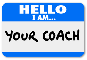 A namtag sticker with the words Hello I Am Your Coach to represe